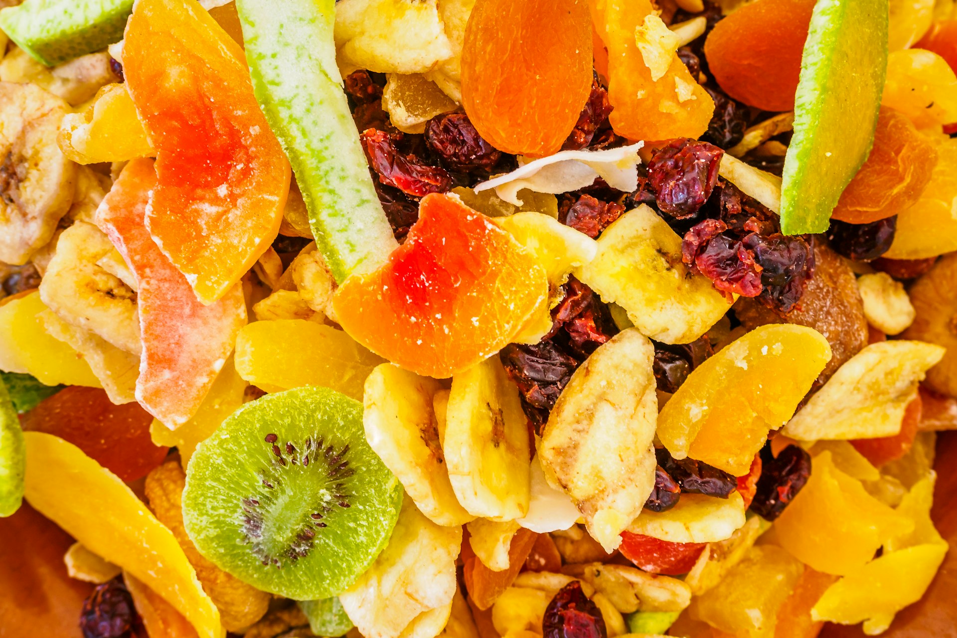 a close up of a mixture of fruit and nuts